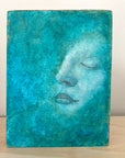 woman in turquoise